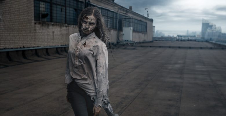 Female zombie on the roof of abandoned building